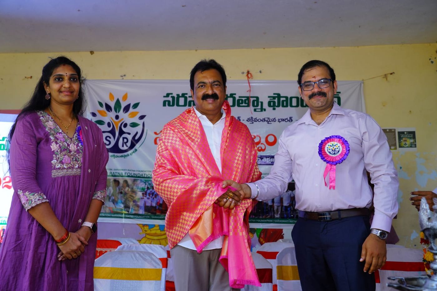 Felicitation moment with a shawl presentation